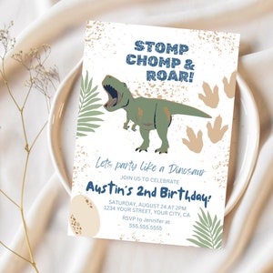 May include: A dinosaur birthday party invitation with a green dinosaur roaring, brown footprints, and green leaves. The text reads "Stomp Chomp & Roar! Let's party like a Dinosaur. Join us to celebrate Austin's 2nd Birthday! Saturday, August 24 at 2pm. 1234 Your Street, Your City, CA. RSVP to Jennifer at 555.555.5555."