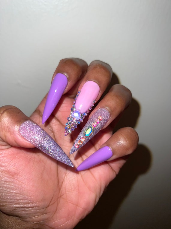 Purple rhinestone nails @nails_by_verovargas  Rhinestone nails, Stiletto  nails, Nail art rhinestones