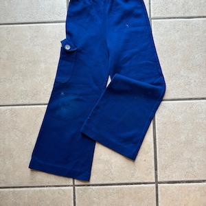 Vintage kids blue bell bottom pants with elastic waist and one pocket size 6