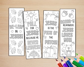 May include: Four rectangular paper bookmarks with black and white line art for coloring. Designs include autumn leaves, a cross with a heart, pumpkins, and a squirrel with acorns. Text includes "BE-LEAF IN JESUS!", "FALL FOR JESUS", "JESUS IS THE PICK OF THE PATCH!", and "ACORN-Y REMINDER: JESUS LOVES YOU!"