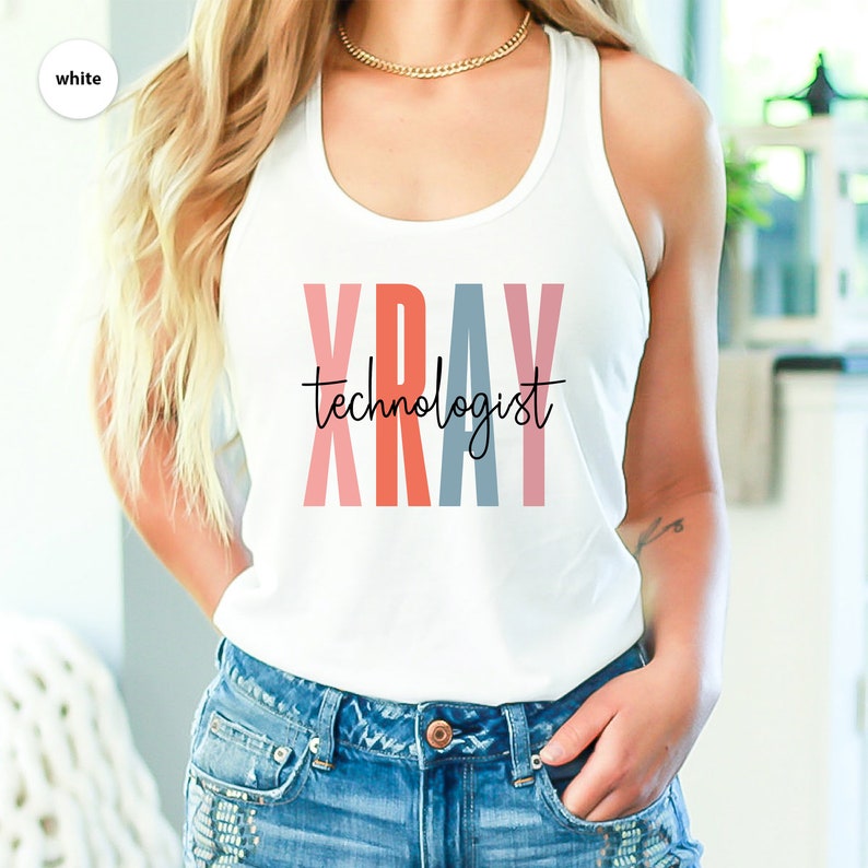 May include: White tank top with the text "XRAY technologist" in colorful letters. The letters are pink, red, blue, and pink.