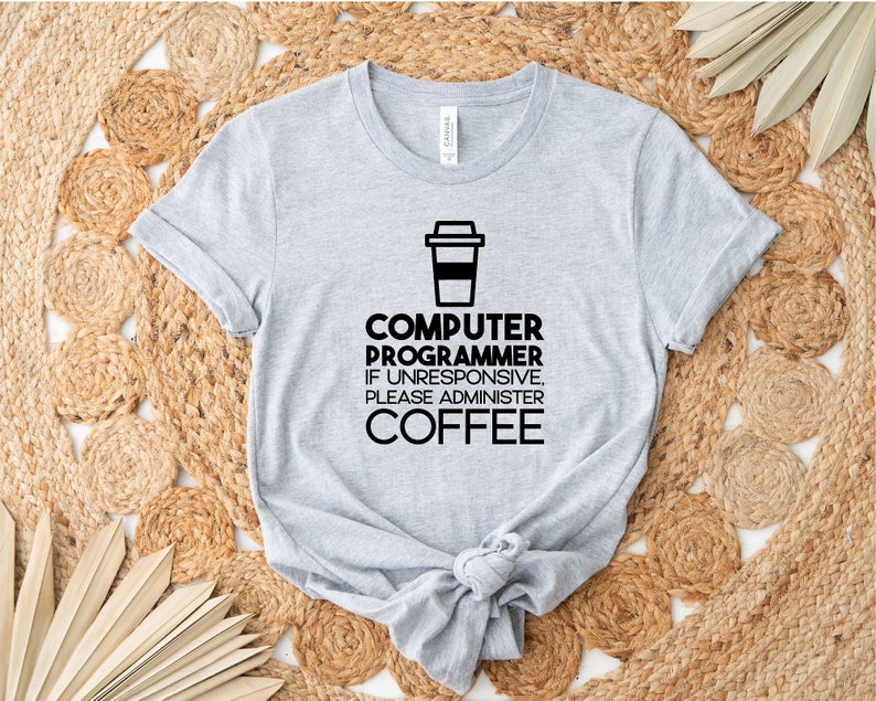 May include: Gray t-shirt with a black graphic of a coffee cup and the text "COMPUTER PROGRAMMER IF UNRESPONSIVE, PLEASE ADMINISTER COFFEE".