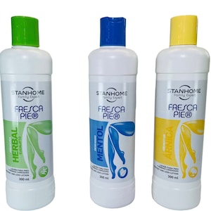 May include: Three white plastic bottles with green, blue, and yellow lids. Each bottle contains a foot lotion with different scents: Herbal Eucalyptus, Menthol, and Arnica. The bottles are labeled "Stanhome Family Expert Fresca Pie®" and have a 300 ml capacity.