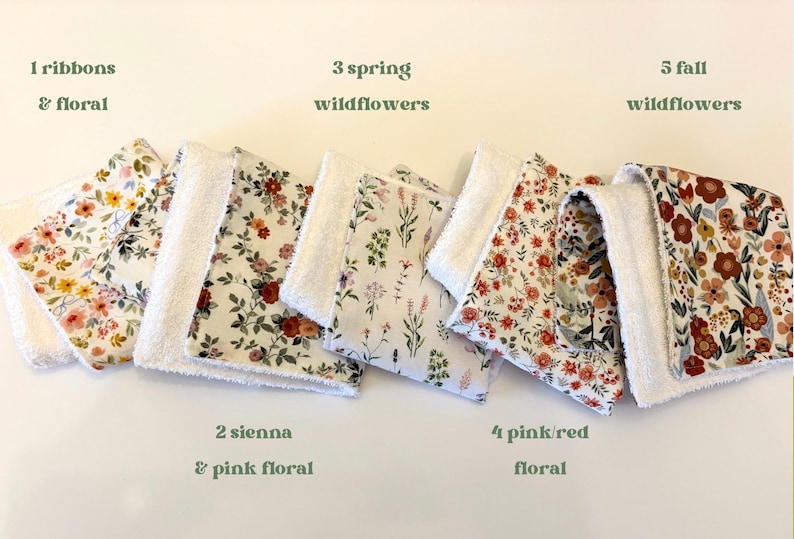May include: A collection of floral patterned fabric squares with white terrycloth borders. The squares feature various floral designs in colors like pink, red, and yellow. Text on the image reads: "1 ribbons & floral", "3 spring wildflowers", "5 fall wildflowers", "2 sienna & pink floral", and "4 pink/red floral".