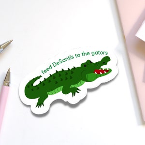 Florida liberale feed Ron DeSantis aan Gators sticker | Grappige politiek-linkse sticker voor tussentijdse verkiezingen | Zeg het protest tegen de homowet