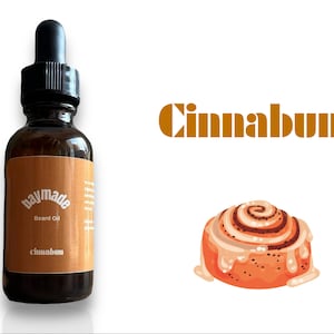 May include: A brown glass bottle with a black dropper top. The label says "baymade Beard Oil" and "cinnabun". A cartoon illustration of a cinnamon bun is shown next to the bottle.