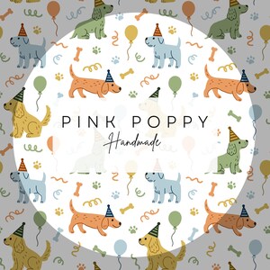 May include: A white background with a circle in the center. The circle has a white background with a pattern of dogs wearing party hats, bones, balloons, and confetti. The text "PINK POPPY Handmade" is in the center of the circle.