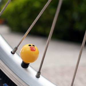 Cartoon yellow duck brown bear valve stem caps for Brompton