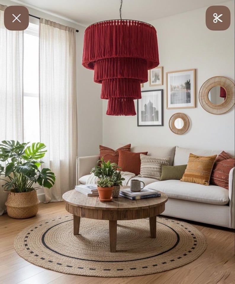 May include: A tiered chandelier featuring multiple layers of deep red fringe hanging from a circular frame. The fixture has a cascading design with each successive tier decreasing in diameter, creating a structured, layered appearance.