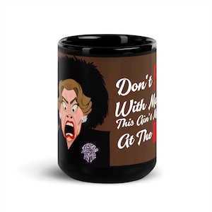 May include: Black coffee mug with a brown background featuring a cartoon woman with a shocked expression and the text "Don't F with Me This Ain't No  At The R"