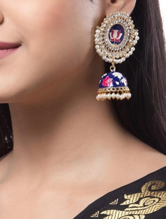 A traditional Indian bell shaped (dome shaped) earrings known as Jhumki has  intricate floral design with small green round-shaped kundan… | Earrings,  Jhumki, Floral