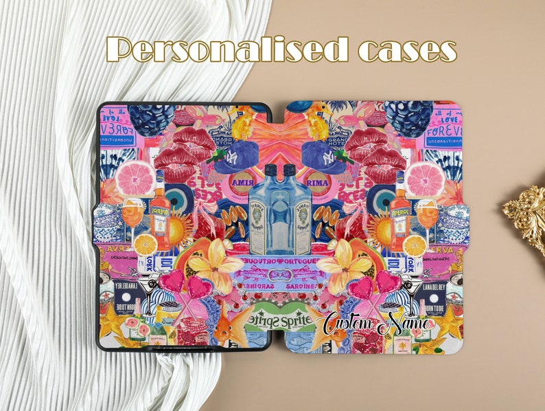 May include: A personalized phone case with a collage of colorful images including fruit, flowers, lips, and drinks. The text 'Custom Name' is visible on the case.