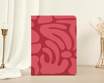 May include: A pink and red abstract pattern book cover with a swirling design.