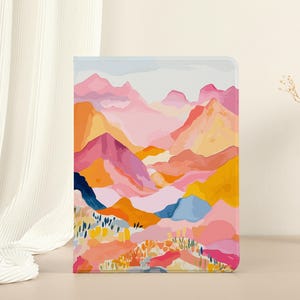 Puede incluir: Pintura abstracta de paisaje con colores rosa, naranja, amarillo y azul. La pintura representa una cordillera con un valle en el centro. Las montañas están pintadas en un estilo estilizado y abstracto.