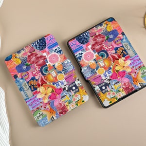 May include: Two e-reader cases with a collage design. The design features a variety of colorful images including fruit, flowers, drinks, and text. The text includes 'I'm Ready', 'Sprite', 'Rima', 'I Love Forever', and 'Gin & Tonic'. The cases are black with a textured surface.