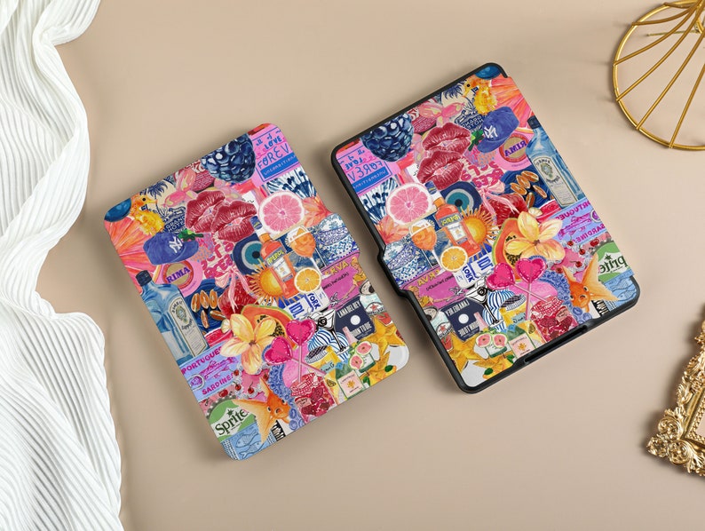 May include: Two e-reader cases with a collage design. The design features a variety of colorful images including fruit, flowers, drinks, and text. The text includes 'I'm Ready', 'Sprite', 'Rima', 'I Love Forever', and 'Gin & Tonic'. The cases are black with a textured surface.
