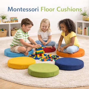 May include: Children sit on colorful round floor cushions while playing with building blocks. The cushions are in shades of blue, yellow, green, and orange. The text "Montessori Floor Cushions" is at the top of the image.