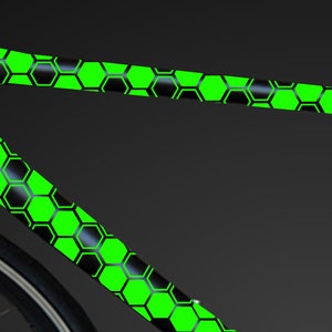 May include: A black bicycle frame with a green honeycomb pattern.