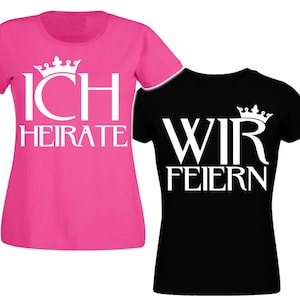 May include: Two t-shirts with a white crown and text. The pink t-shirt says "ICH HEIRATE" and the black t-shirt says "WIR FEIERN".