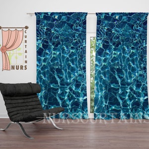 May include: A pair of blue curtains with a water ripple pattern. The curtains are hung on a white wall and there is a black chair in the foreground.