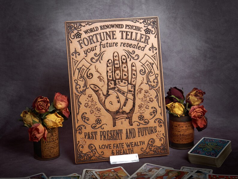 May include: A vintage-style fortune teller sign with a hand palm reading chart, the text "WORLD RENOWNED PSYCHIC FORTUNE TELLER your future revealed PAST PRESENT AND FUTURE LOVE FATE WEALTH & HEALTH", and ornate decorative flourishes.