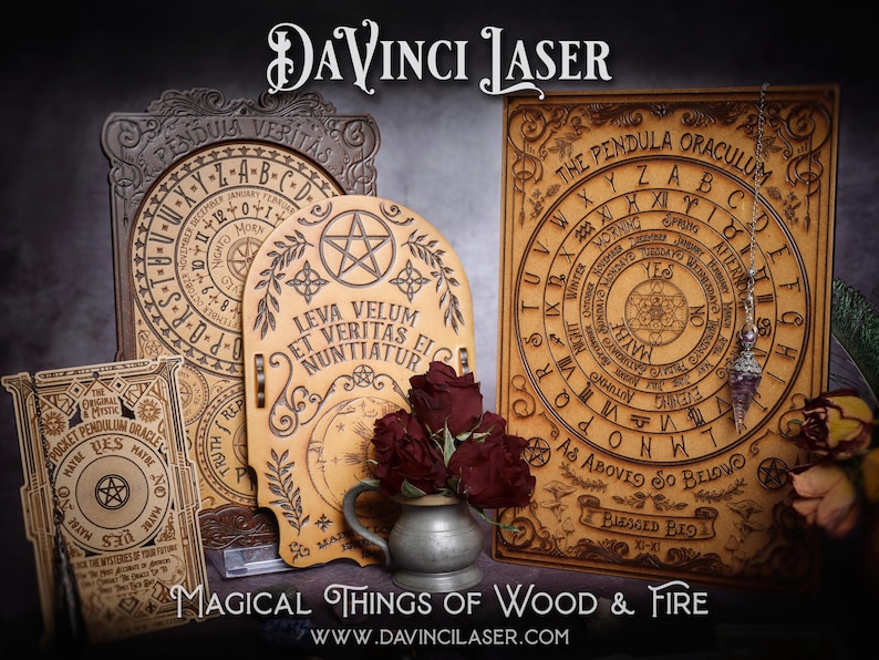 May include: Three wooden pendulum boards with intricate designs and text, including "The Pendula Oraculum", "Pendula Veritas", and "Leva Velum Et Veritas Ei Nuntiatur". The boards are surrounded by red roses and a silver pitcher.