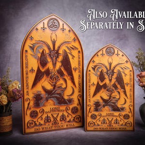 May include: Two wooden plaques with a gothic design featuring a depiction of Baphomet, a horned figure with wings. The plaques are brown and gold with the text "As Above So Below" and "Do What Thou Wilt" on them.
