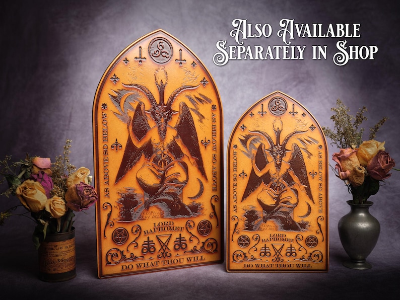 May include: Two wooden plaques with a gothic design featuring a depiction of Baphomet, a horned figure with wings. The plaques are brown and gold with the text "As Above So Below" and "Do What Thou Wilt" on them.