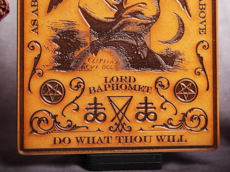 May include: A brown leather plaque with a pentagram and the words "Lord Baphomet" and "Do What Thou Wilt".