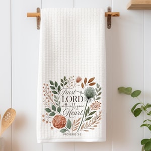 May include: White kitchen towel with a floral design and the text "Trust in the LORD with all your Heart. Proverbs 3:5"