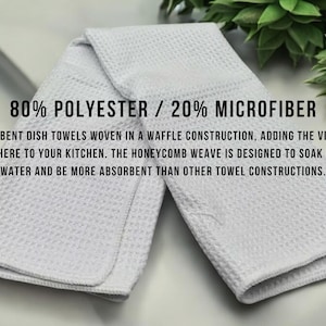 May include: White absorbent dish towels with a waffle weave. The towels are made of 80% polyester and 20% microfiber. The text on the image says the honeycomb weave is designed to soak up more water.