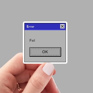 May include: A blue and gray computer error message sticker with the text "Error" and "Fail" and an "OK" button.