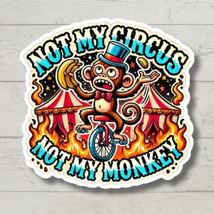 May include: A white sticker with a cartoon monkey riding a unicycle in front of a circus tent. The monkey is wearing a blue and white hat and a red bow tie. The sticker says "Not my circus, not my monkey".
