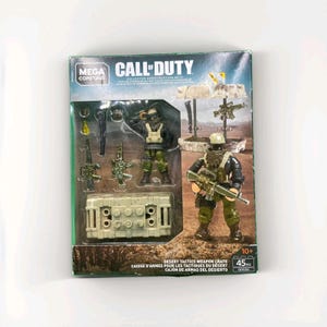 May include: A Mega Construx Call of Duty Desert Tactics Weapon Crate set. The box features a soldier figure with a rifle, a crate, and other military-themed accessories. The set includes 45 pieces and is for ages 10+.