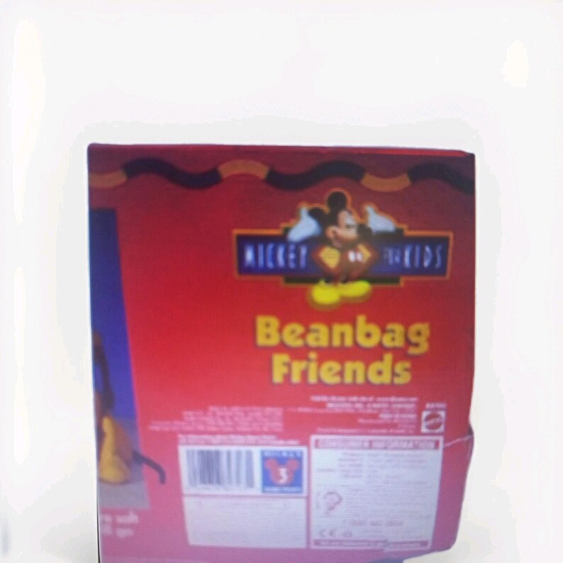 May include: A red box featuring the text "Mickey & Kids Beanbag Friends" with a Mickey Mouse graphic. The box has a blue side and a red top with a brown and orange border. The box is for children ages 3 and up.