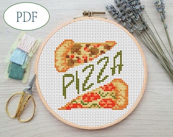 May include: A cross-stitch pattern featuring two slices of pizza and the word "PIZZA" in green letters. The pattern is displayed in a wooden embroidery hoop.