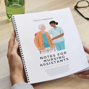 May include: A spiral bound notebook with a white cover and colourful illustrations. The cover reads "Easy to understand" and "Notes for Nursing Assistants".