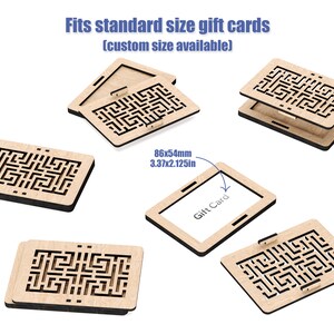 May include: Wooden gift card holder with a laser-cut intricate maze design. The holder is open to show the inside, which is designed to fit a standard size gift card. The text "Gift Card" is printed on a white card inside the holder. The dimensions of the card are 86 x 54 mm.