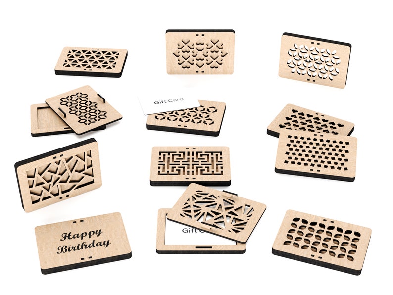 May include: A collection of nine wooden gift card holders, each featuring a unique laser-cut design. The designs include geometric patterns, hearts, and floral motifs. The holders are crafted from natural wood and have a rustic, handmade appearance. Two of the holders display the text "Happy Birthday" and "Gift Card".