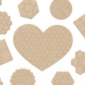 May include: A set of wooden jigsaw puzzle pieces in various shapes, including a heart, circle, hexagon, square, and pentagon. The pieces are all made of light brown wood and have a natural grain pattern.