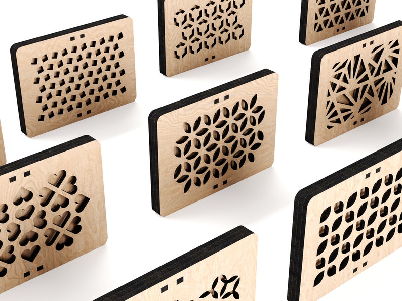 May include: Seven wooden plaques with different laser-cut geometric patterns. The plaques are light brown with black edges and are arranged in a staggered pattern on a white background.