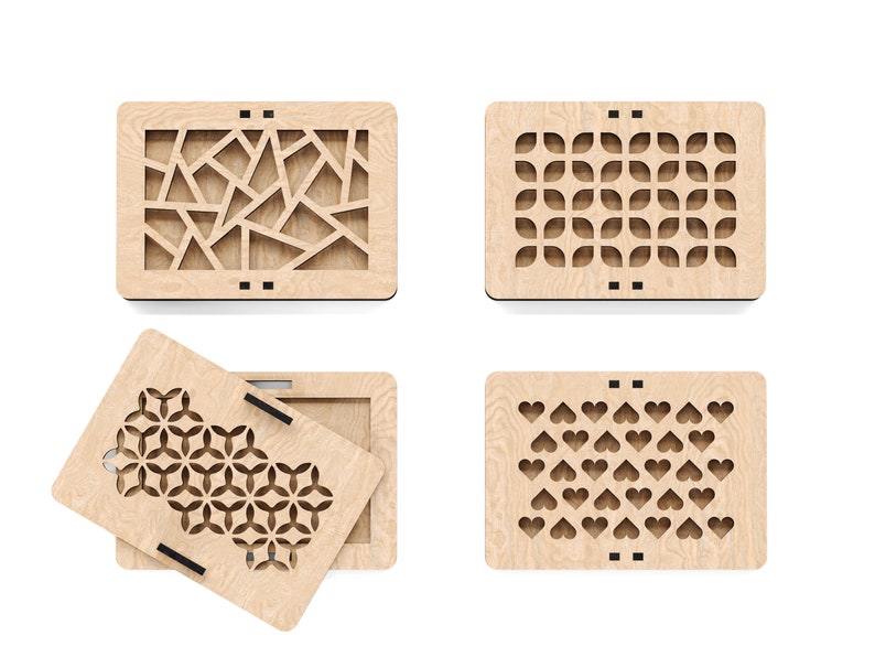 May include: Four wooden boxes with different laser cut designs. The boxes are made of light wood and have a natural finish. The designs include geometric shapes, flowers, and hearts.