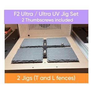 May include: An F2 Ultra / Ultra UV Jig Set with two thumbscrews included. The set includes two jigs with T and L fences. The image shows four gray slate-like squares arranged in a square pattern.