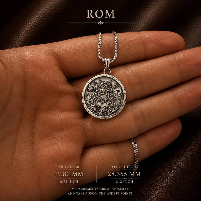 A silver pendant necklace featuring a detailed circular charm. The charm depicts a woman with long hair, flanked by two stylized animal figures. The pendant hangs from a delicate silver chain, creating an elegant accessory.