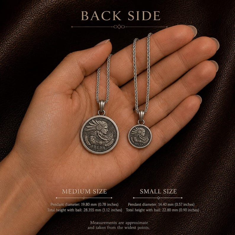 May include: Two silver-toned circular pendants on chains, labeled BACK SIDE. The medium pendant is 0.78 inches in diameter and 1.12 inches high with bail. The small pendant is 0.57 inches in diameter and 0.90 inches high with bail. Both feature a relief of Freya.