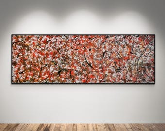 May include: A rectangular abstract painting in a thin black frame featuring a dense, layered composition of vibrant red, white, and black paint splatters and swirling lines that create a complex, textured visual effect across the entire canvas.