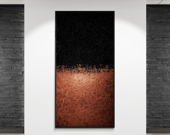May include: Abstract art piece with a textured black upper half and a textured copper-colored lower half. The artwork is displayed in a black frame and mounted on a white wall.