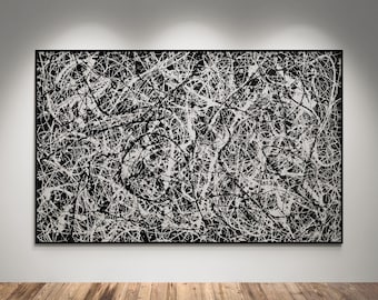 May include: A rectangular wall art piece featuring a dense, chaotic pattern of overlapping white paint splatters and drips against a solid black background, all enclosed within a thin, dark, minimalist frame.