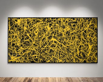 May include: A large rectangular wall art piece featuring a black background covered in a dense, chaotic network of bright yellow paint splatters and drips, enclosed within a thin black frame, displayed horizontally on a neutral wall.