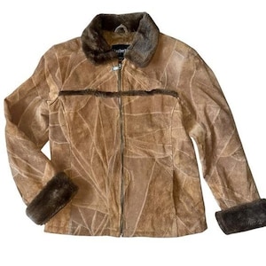 May include: A set of three ceramic mugs with a speckled, matte finish. The mugs are in shades of cream, light gray, and dark gray. Each mug has a simple, minimalist design, perfect for coffee or tea.